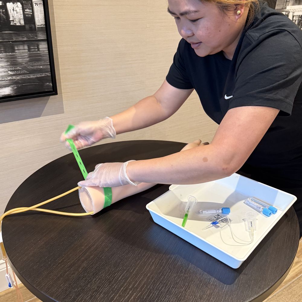 Nurse practising cannulation during clinical training