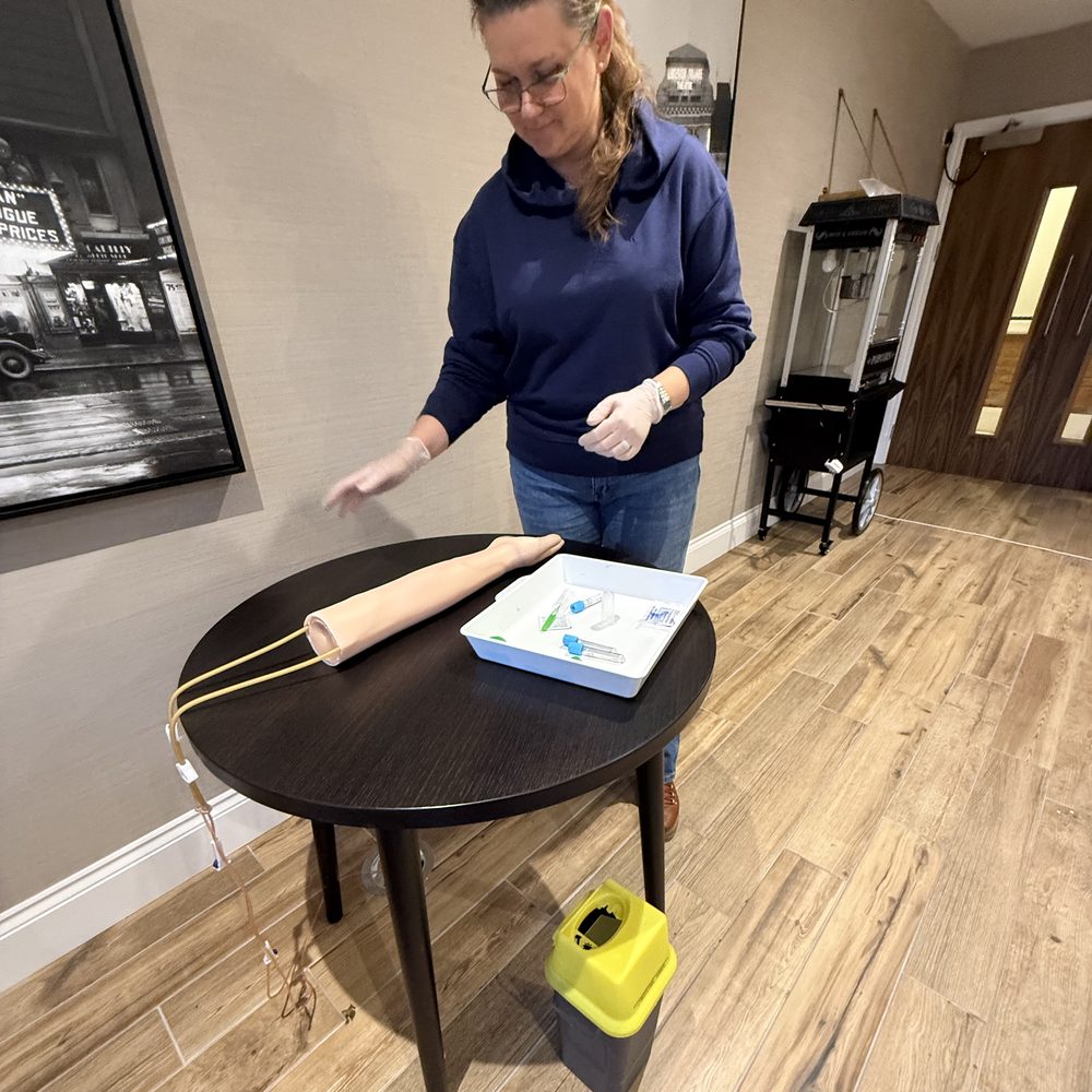 Orchard Rock trainer preparing a clinical practice arm