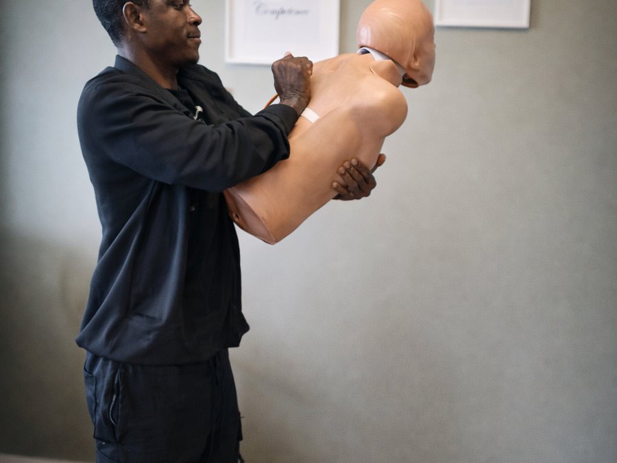 Practising choking treatment on a manikin