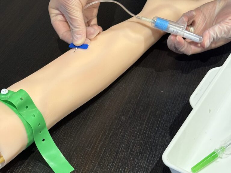 IV cannulation practice on a clinical training arm