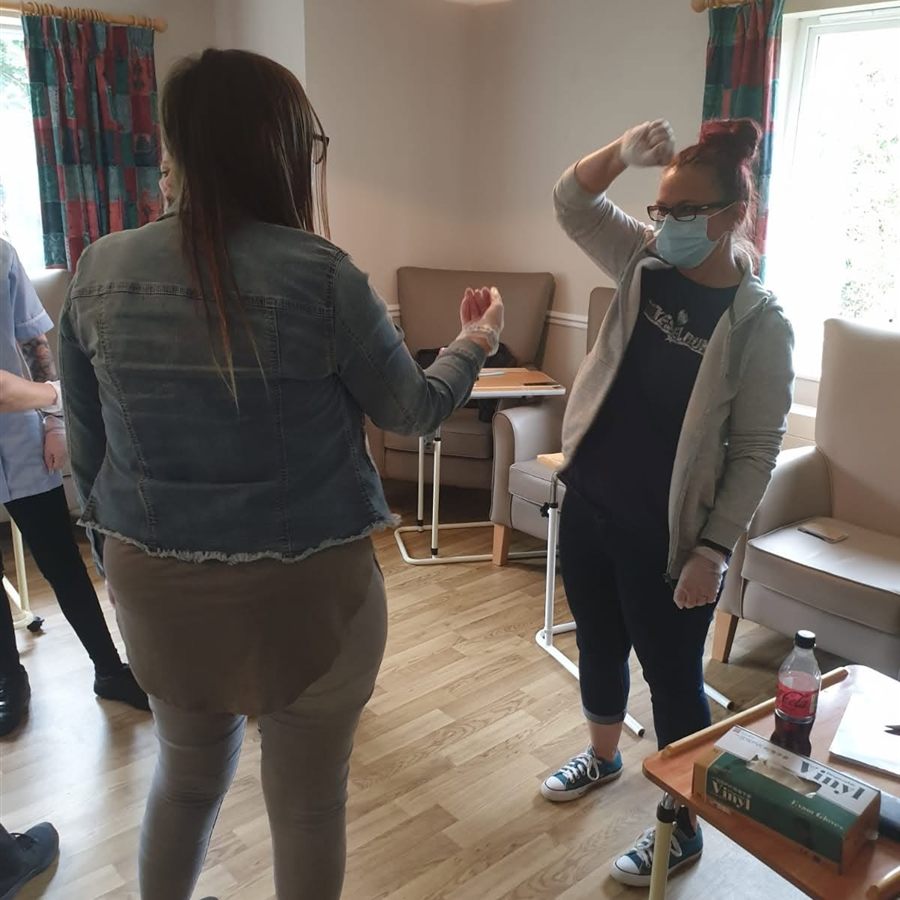 A delegate raising her arm to release a grip during breakaway training
