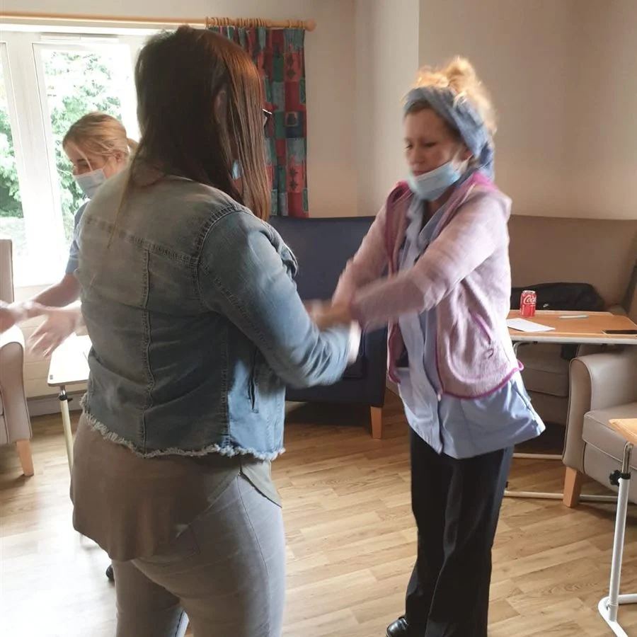 A delegate practising a breakaway technique with a colleague during training