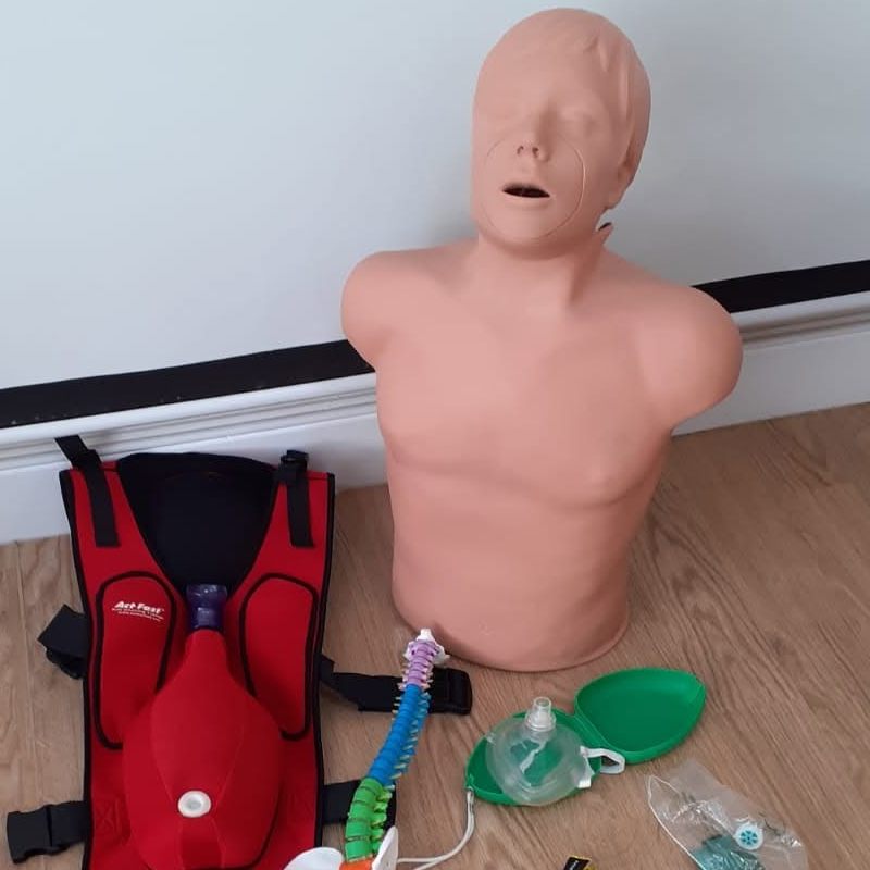 First aid training kit: a CPR manikin, a choking training vest, pocket masks and a spine model